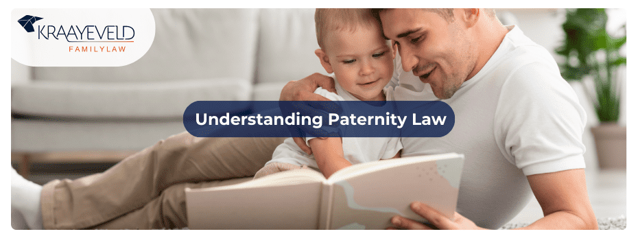 Unmarried father playing with his toddler son, making use of his right as stated in MI Paternity Law
